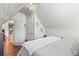 Cozy bedroom featuring bright white walls, hardwood floors, and unique architectural details at 1160 York St, Denver, CO 80206