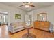 Cozy bedroom featuring hardwood floors, a sofa, and a dresser at 1160 York St, Denver, CO 80206