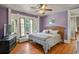 Stylish bedroom featuring a hardwood floors, decorative molding and large window at 1160 York St, Denver, CO 80206