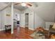 Spacious bonus room featuring hardwood floors, gray walls, and a mini fridge at 1160 York St, Denver, CO 80206