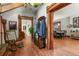 Beautiful foyer with original hardwood floors, ornate woodwork, and a glimpse into the dining area at 1160 York St, Denver, CO 80206