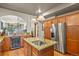 Gourmet kitchen featuring stainless steel appliances, granite countertops, and hardwood floors at 1160 York St, Denver, CO 80206