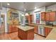 Well-appointed kitchen featuring an island, granite countertops, stainless steel appliances, and tile backsplash at 1160 York St, Denver, CO 80206