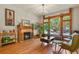 Elegant living room featuring a fireplace, hardwood floors, large windows, and ample natural light at 1160 York St, Denver, CO 80206