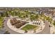 Overhead view of a community park with shaded seating, lush landscaping, and walking paths at 4958 Valentia Ct, Denver, CO 80238