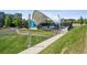 Outdoor amphitheater with covered stage and grassy seating area in a well-maintained community space at 4958 Valentia Ct, Denver, CO 80238