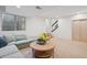 Spacious basement with comfortable seating, natural light, and easy access to stairs at 4958 Valentia Ct, Denver, CO 80238