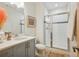 Contemporary bathroom features glass-enclosed shower, sleek vanity, and modern decor at 4958 Valentia Ct, Denver, CO 80238