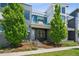 Inviting two-story home with modern siding, an attractive porch, and well-maintained landscaping at 4958 Valentia Ct, Denver, CO 80238