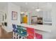 Bright kitchen with a large island, stainless steel appliances, and stylish pendant lighting at 4958 Valentia Ct, Denver, CO 80238