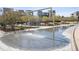 Modern water feature in a community space with pedestrian access, landscaping, and seating at 4958 Valentia Ct, Denver, CO 80238