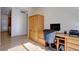 Bedroom featuring wooden floors, wooden closet and workstation, and natural light at 10588 Parkington Ln # 39A, Highlands Ranch, CO 80126