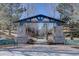 Stone pillars mark the entrance to Highland Walk, a community green space with paved walking path at 10588 Parkington Ln # 39A, Highlands Ranch, CO 80126