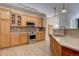 A modern kitchen featuring stainless steel appliances and ample cabinet space at 10588 Parkington Ln # 39A, Highlands Ranch, CO 80126