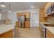 Modern kitchen features stainless steel appliances, light wood cabinets and countertops, and a tiled backsplash at 10588 Parkington Ln # 39A, Highlands Ranch, CO 80126
