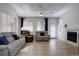A bright living room with a fireplace, neutral tones, and great natural light at 10588 Parkington Ln # 39A, Highlands Ranch, CO 80126