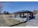 Outdoor picnic area with covered pavilion, stone pillars, and picnic tables for residents at 10588 Parkington Ln # 39A, Highlands Ranch, CO 80126