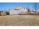 Spacious backyard with a wooden deck, white siding, and privacy fencing at 14552 E Tufts Ave, Aurora, CO 80015