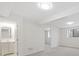 Spacious basement area with neutral carpeting, recessed lighting, and a bathroom entrance at 14552 E Tufts Ave, Aurora, CO 80015