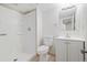 Well-lit bathroom features a walk in shower, a modern vanity and tile floors at 14552 E Tufts Ave, Aurora, CO 80015