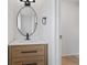 Modern bathroom featuring a wooden vanity, and sleek fixtures at 14552 E Tufts Ave, Aurora, CO 80015