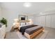 Stylish bedroom with a comfortable bed, modern lighting, and ample closet space at 14552 E Tufts Ave, Aurora, CO 80015