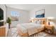 Bright bedroom with minimalist decor, neutral colors, and a large window at 14552 E Tufts Ave, Aurora, CO 80015