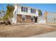 Charming two-story home with a brick facade, white siding, and a well-maintained front lawn at 14552 E Tufts Ave, Aurora, CO 80015