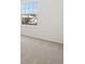 Carpeted living room with a window with natural light at 14552 E Tufts Ave, Aurora, CO 80015