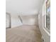 Bright and airy living room with neutral carpet and staircase at 14552 E Tufts Ave, Aurora, CO 80015