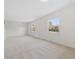 Bright and airy living room with neutral carpet at 14552 E Tufts Ave, Aurora, CO 80015