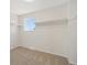 Empty walk-in closet with carpet and a small window for light at 14552 E Tufts Ave, Aurora, CO 80015
