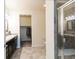 Bathroom showcasing double vanity, walk-in closet, and glass-enclosed shower, offering style and convenience at 1640 Aspen Meadows Cir, Federal Heights, CO 80260