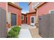 Inviting courtyard entry featuring colorful siding, a gray front door, and low-maintenance landscaping at 1640 Aspen Meadows Cir, Federal Heights, CO 80260