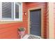 Charming front entrance with a gray door, a colorful flower pot, and a stylish welcome mat at 1640 Aspen Meadows Cir, Federal Heights, CO 80260