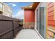 Private outdoor patio with stained wood fencing, accessible through a sliding glass door at 1640 Aspen Meadows Cir, Federal Heights, CO 80260