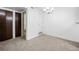 Bright dining room with a chandelier and access to bathroom and closets at 8335 Fairmount Dr # 7-204, Denver, CO 80247