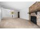 Open living and dining area with fireplace at 8335 Fairmount Dr # 7-204, Denver, CO 80247