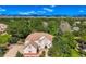 Stunning aerial view of the property showcasing lush greenery, mountain views, and landscaping, adding to the curb appeal at 7355 Nile St, Arvada, CO 80007