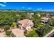 Beautiful home with a well-manicured lawn, mature trees and a scenic mountain view at 7355 Nile St, Arvada, CO 80007