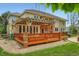 Home exterior showing the wooden deck with pergola and landscaped backyard at 7355 Nile St, Arvada, CO 80007
