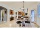 Bright kitchen boasts tile floors, breakfast nook, ample cabinetry, stainless appliances, and desk space at 7355 Nile St, Arvada, CO 80007