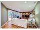 Bright living room with hardwood floors, fireplace, and access to the backyard at 7355 Nile St, Arvada, CO 80007
