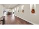 Finished basement with hardwood floors, recessed lighting, and built-in wall niches displaying musical instruments at 3421 E 143Rd Dr, Thornton, CO 80602