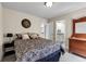 Cozy bedroom with neutral tones, a plush bed, and easy access to an ensuite bathroom and closet at 3421 E 143Rd Dr, Thornton, CO 80602