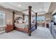 Main bedroom with four poster bed, windows with a view, and neutral color scheme at 3421 E 143Rd Dr, Thornton, CO 80602
