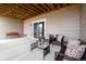 Relaxing covered patio featuring comfortable seating and stylish decor at 3421 E 143Rd Dr, Thornton, CO 80602