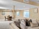 The finished basement features a sofa, table, and dining area with windows at 693 Syracuse St, Denver, CO 80230