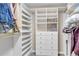 Spacious walk-in closet features custom organizers, drawers, and shelves for efficient storage and organization at 693 Syracuse St, Denver, CO 80230