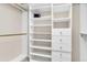 Organized walk-in closet with custom shelving, drawers, and ample hanging space for optimal storage at 693 Syracuse St, Denver, CO 80230